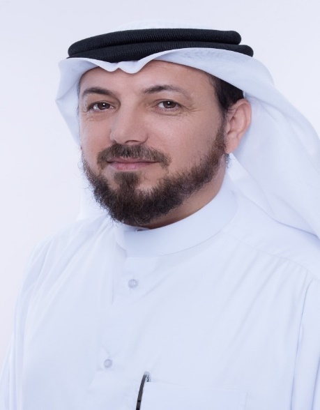 A person in a white robe
Description automatically generated