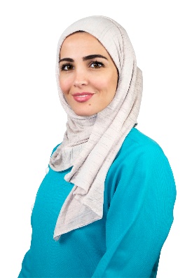 A person wearing a head scarf
Description automatically generated
