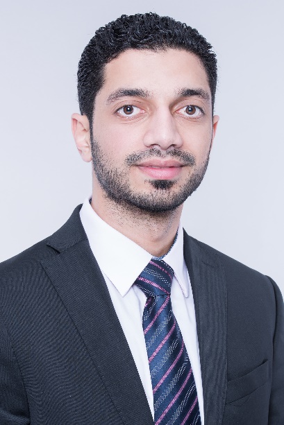 A person in a suit and tie
Description automatically generated